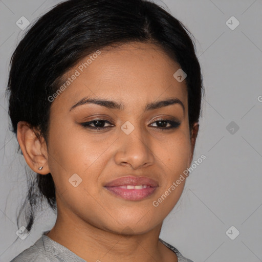 Joyful latino young-adult female with medium  brown hair and brown eyes