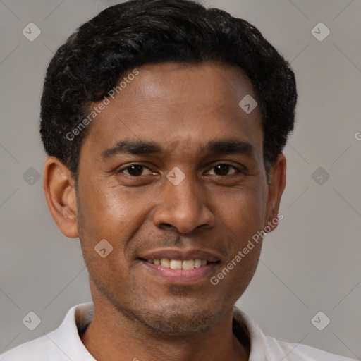 Joyful latino young-adult male with short  brown hair and brown eyes