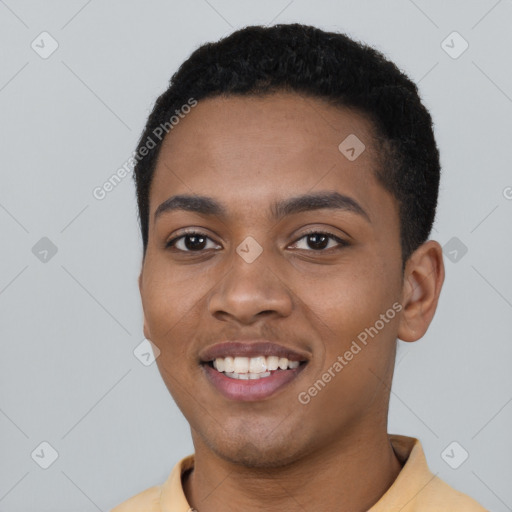 Joyful black young-adult male with short  black hair and brown eyes