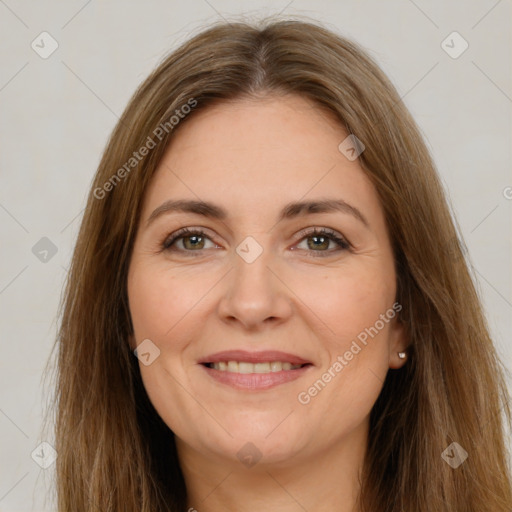 Joyful white adult female with long  brown hair and brown eyes