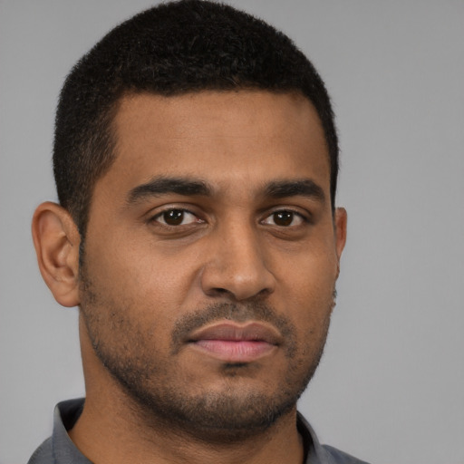 Neutral black young-adult male with short  brown hair and brown eyes