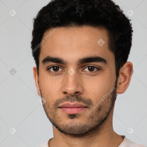 Neutral latino young-adult male with short  black hair and brown eyes