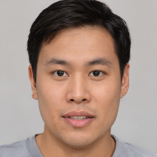 Neutral asian young-adult male with short  brown hair and brown eyes