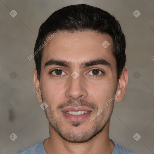 Joyful white young-adult male with short  black hair and brown eyes