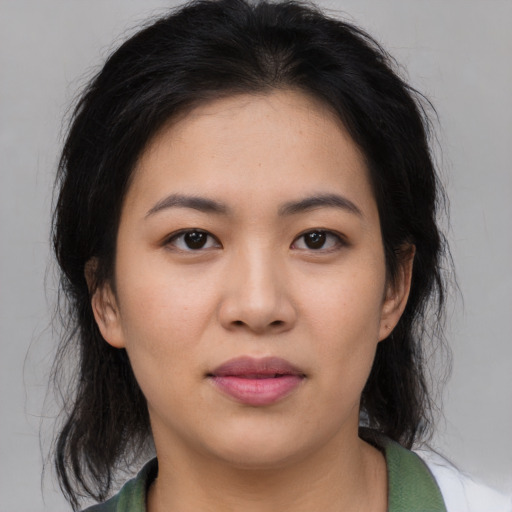 Joyful asian young-adult female with medium  black hair and brown eyes