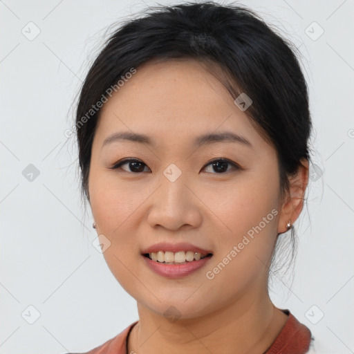 Joyful asian young-adult female with short  brown hair and brown eyes