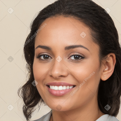 Joyful latino young-adult female with medium  brown hair and brown eyes