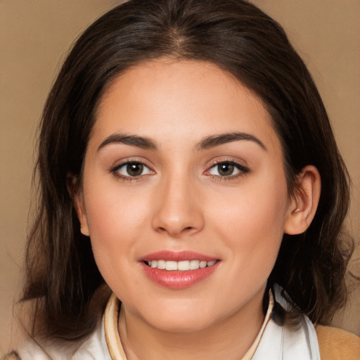 Joyful white young-adult female with medium  brown hair and brown eyes