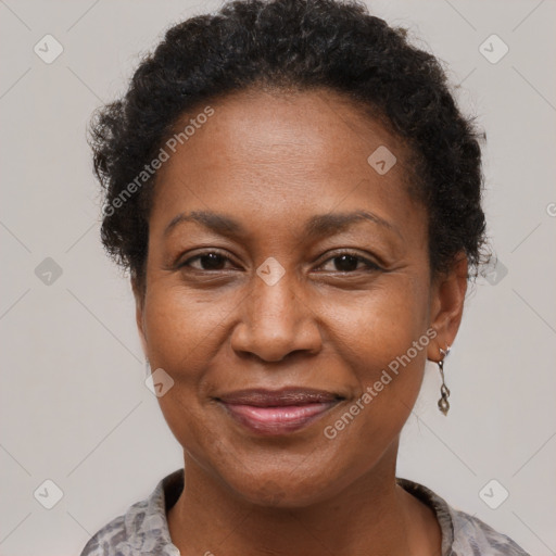 Joyful black adult female with short  brown hair and brown eyes