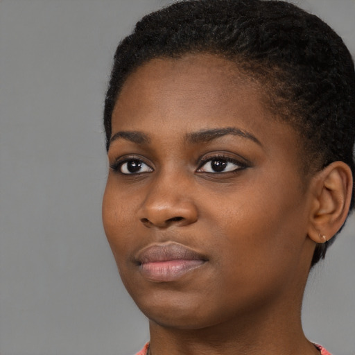 Neutral black young-adult female with short  brown hair and brown eyes