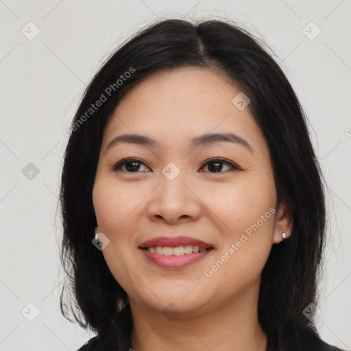 Joyful asian young-adult female with long  brown hair and brown eyes