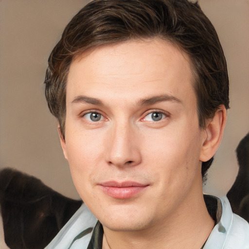 Joyful white young-adult male with medium  brown hair and brown eyes