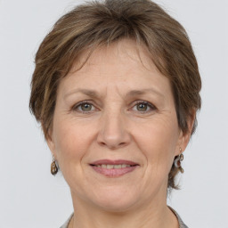 Joyful white adult female with short  brown hair and brown eyes