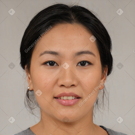 Joyful asian young-adult female with medium  black hair and brown eyes