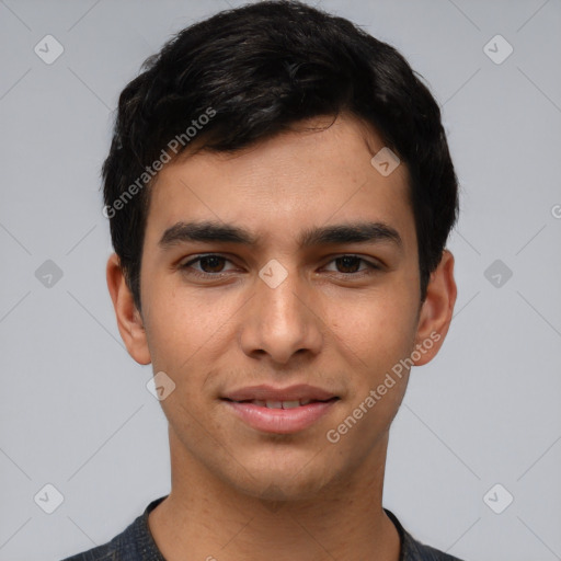 Joyful white young-adult male with short  black hair and brown eyes