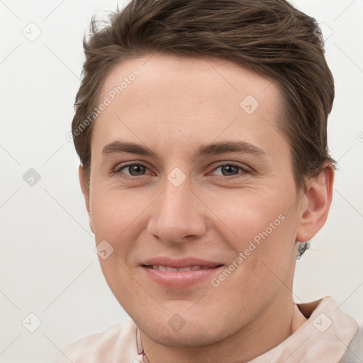 Joyful white young-adult female with short  brown hair and grey eyes