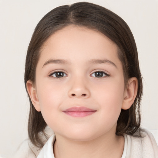 Joyful white child female with medium  brown hair and brown eyes