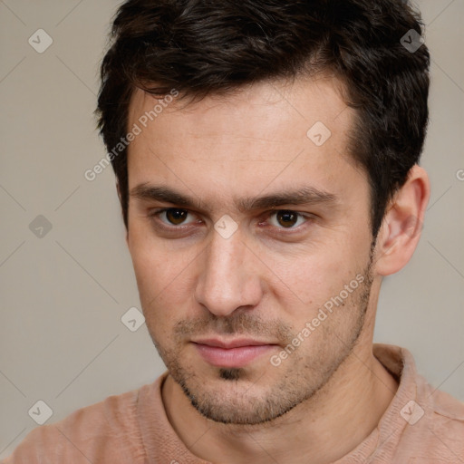 Neutral white young-adult male with short  brown hair and brown eyes