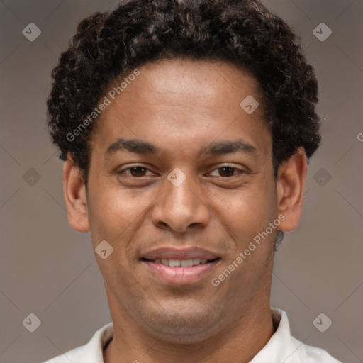 Joyful latino young-adult male with short  brown hair and brown eyes