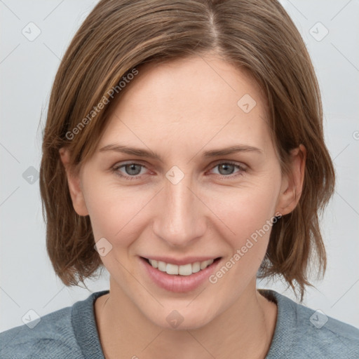 Joyful white young-adult female with medium  brown hair and blue eyes