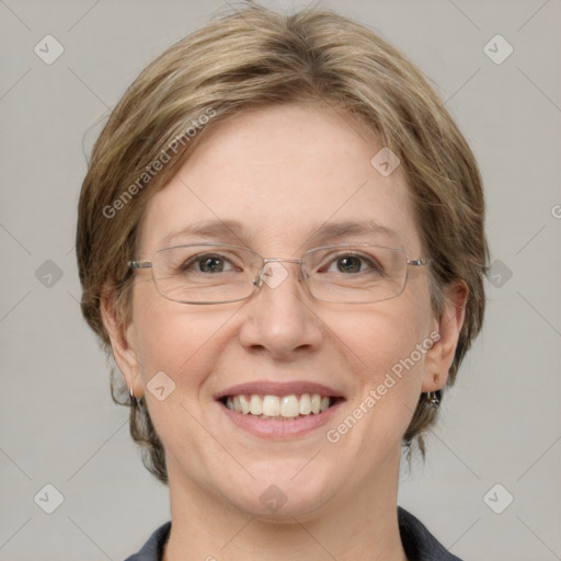 Joyful white adult female with medium  brown hair and blue eyes