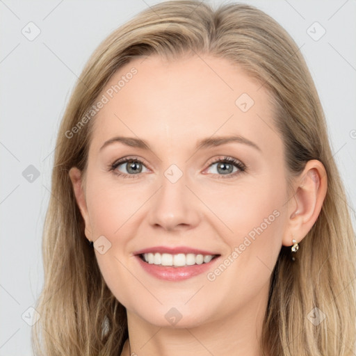 Joyful white young-adult female with long  brown hair and blue eyes