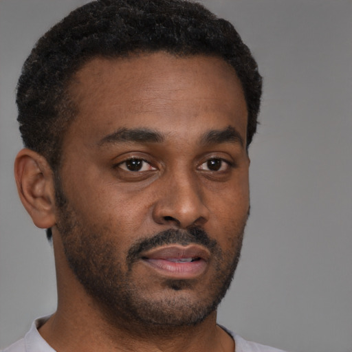 Neutral black young-adult male with short  brown hair and brown eyes