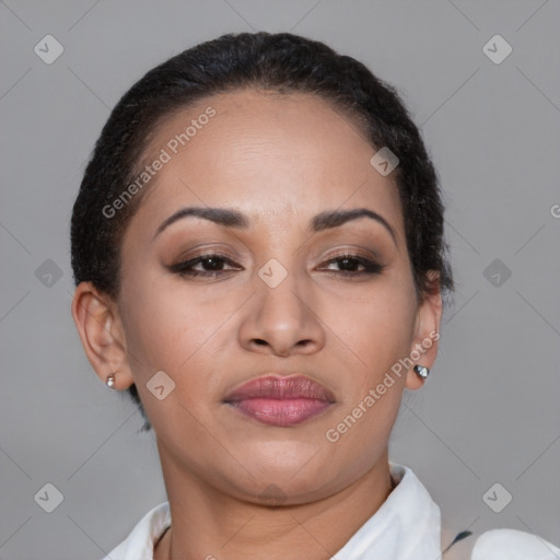 Joyful latino young-adult female with short  brown hair and brown eyes