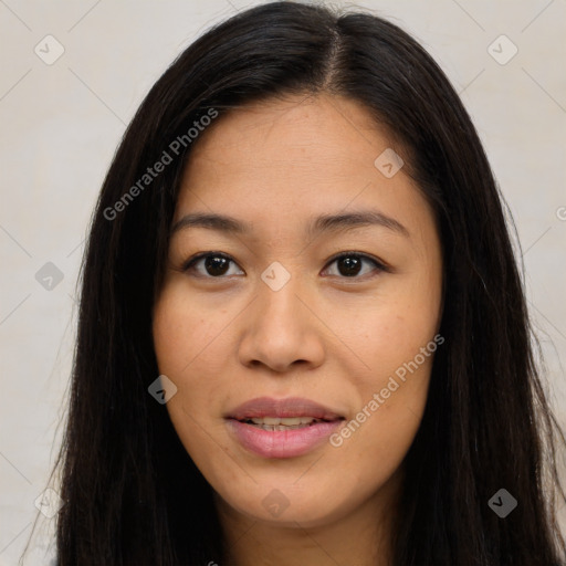 Joyful latino young-adult female with long  brown hair and brown eyes