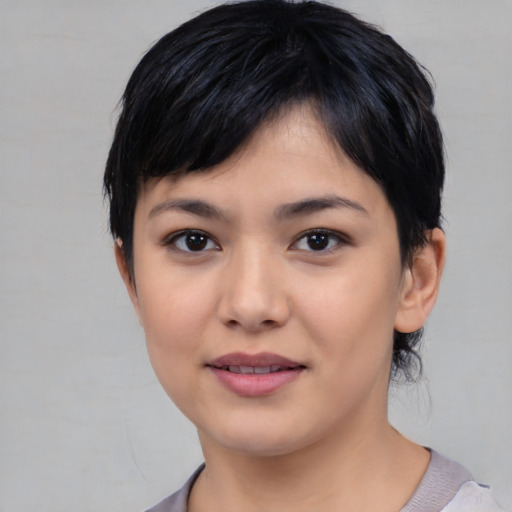 Joyful asian young-adult female with medium  black hair and brown eyes