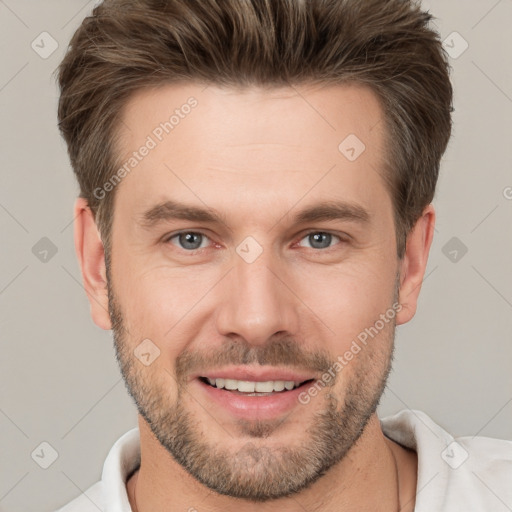 Joyful white adult male with short  brown hair and brown eyes