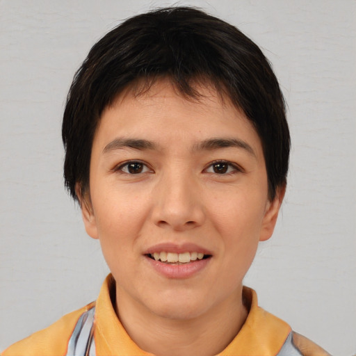 Joyful white young-adult female with short  black hair and brown eyes