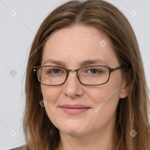 Joyful white adult female with long  brown hair and brown eyes