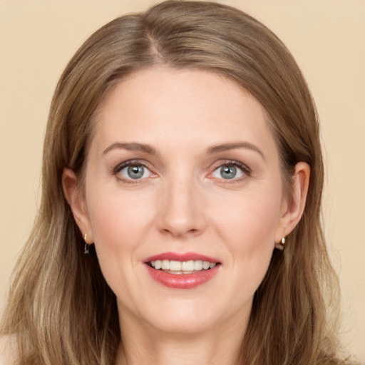 Joyful white young-adult female with long  brown hair and grey eyes