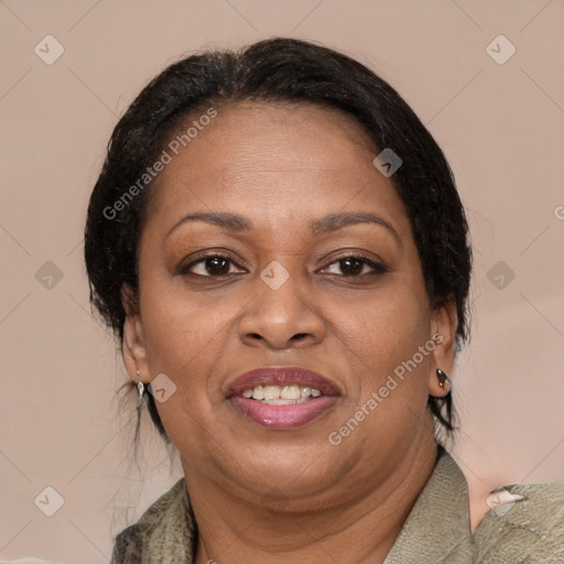 Joyful black adult female with medium  brown hair and brown eyes