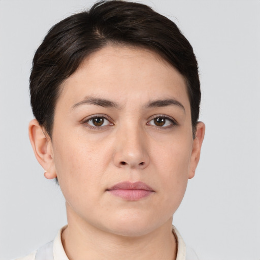 Neutral white young-adult female with short  brown hair and brown eyes