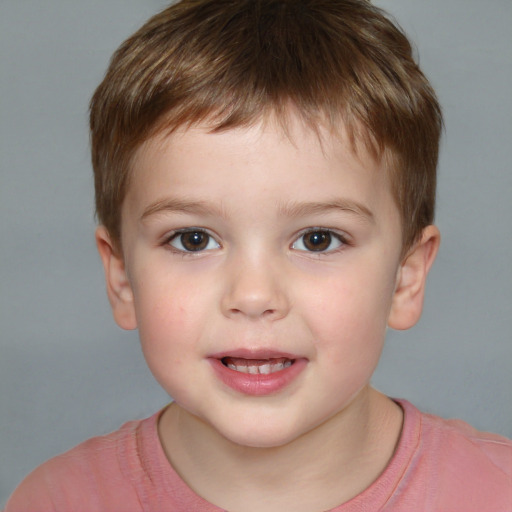 Joyful white child male with short  brown hair and brown eyes