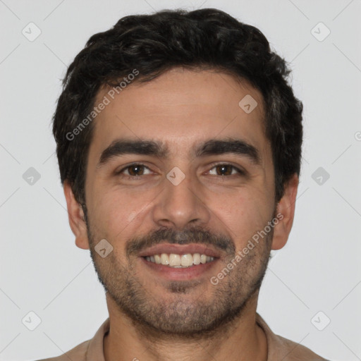 Joyful white young-adult male with short  black hair and brown eyes