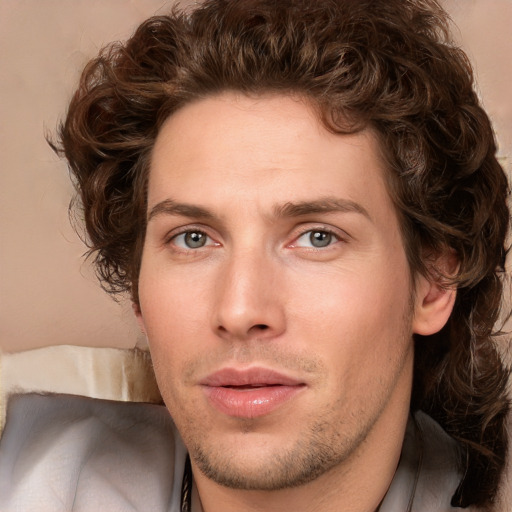 Joyful white young-adult male with medium  brown hair and brown eyes