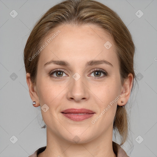 Joyful white young-adult female with medium  brown hair and grey eyes