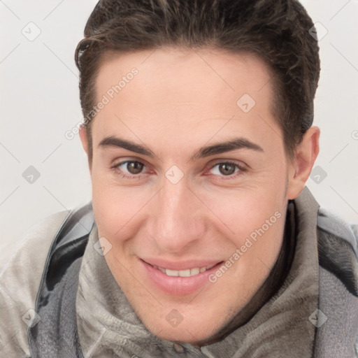 Joyful white young-adult female with short  brown hair and brown eyes