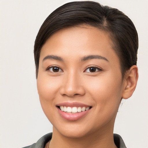 Joyful white young-adult female with short  brown hair and brown eyes