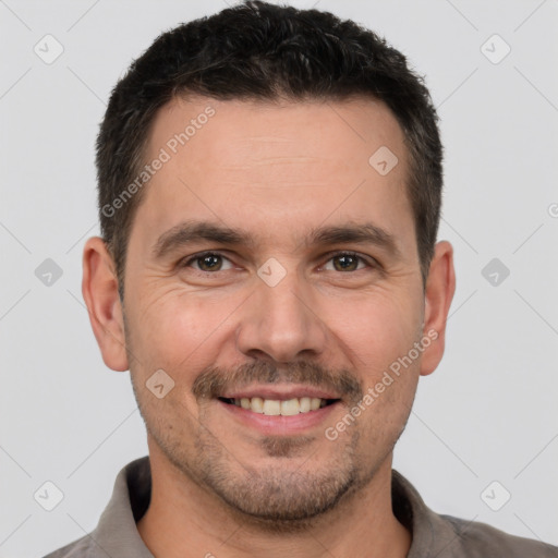 Joyful white adult male with short  brown hair and brown eyes