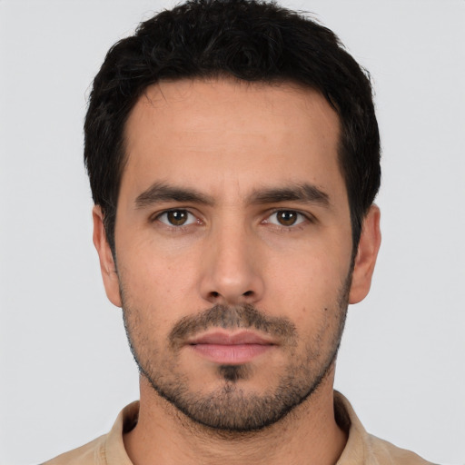 Neutral white young-adult male with short  black hair and brown eyes
