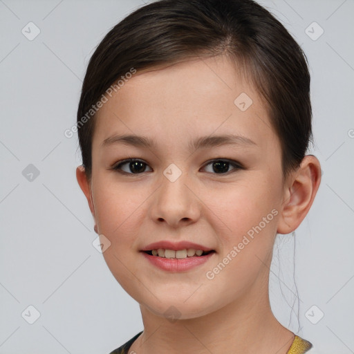 Joyful white child female with short  brown hair and brown eyes