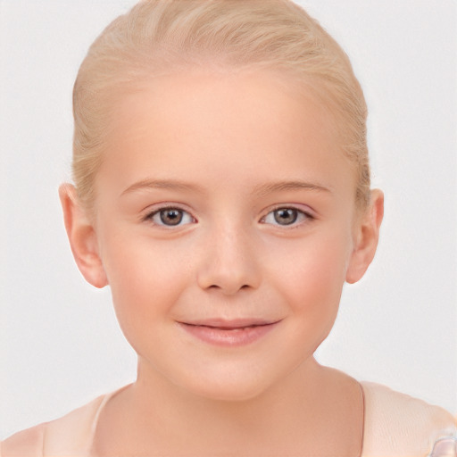 Joyful white child female with short  blond hair and brown eyes