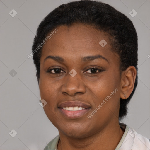 Joyful black young-adult female with short  brown hair and brown eyes