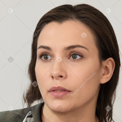 Neutral white young-adult female with medium  brown hair and brown eyes