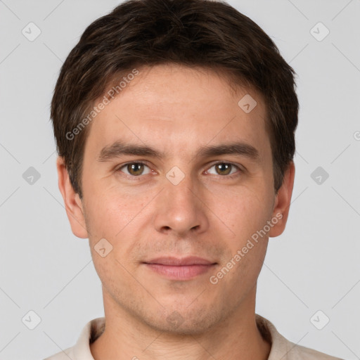 Joyful white young-adult male with short  brown hair and brown eyes