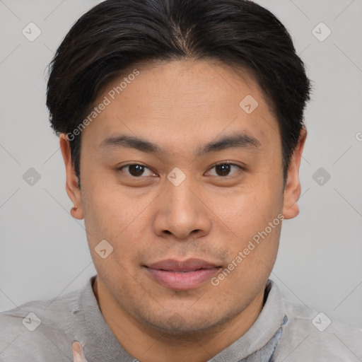 Joyful asian young-adult male with short  brown hair and brown eyes